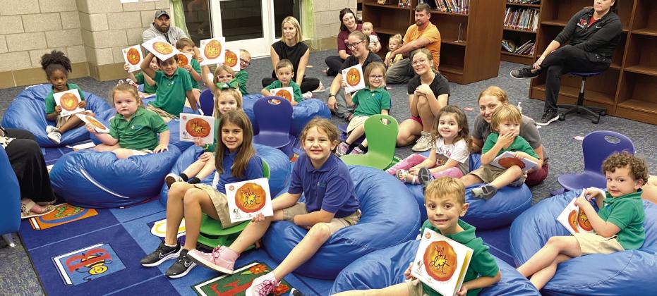 Belle Chasse Primary’s Pre-K students and their families gather in the school’s library for story-time at the November 2 Prime-Time Reading session.