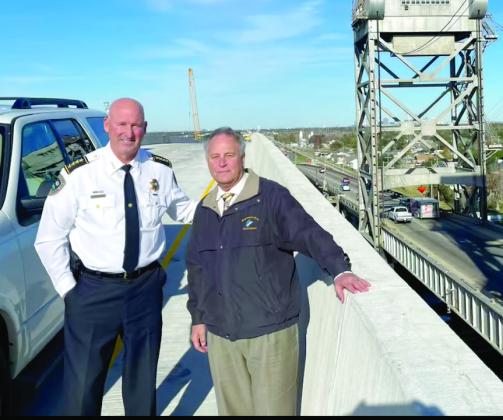 Plaquemines Parish Sheriff Jerry Turlich, left, and Parish President Keith Hinkley took a ceremonial last ride through the Belle Chasse Tunnel before it permanently closed and paused for a photo on the subsequent first ride across the new Belle Chasse Bridge when the transition took place on December 20.