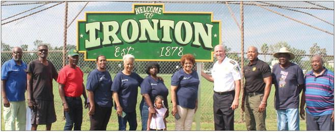 Sheriff Jerry Turlich and Major Byron Williams alongside residents of the Ironton Subdivision.