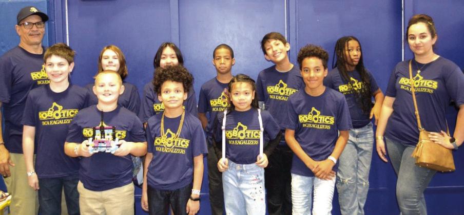 Pictured in the front row, from left: Jack Gerwitz, Kurtis Turman Jr, Samantha Velasco, Julian Rodriguez and Chloe Dowden. Back row, from left: Charles Box, Coach Michael Roussell, Novalee Polanski, Alexys Block, Mason Dillard, Sebastian Payne and Kennedy Savage.