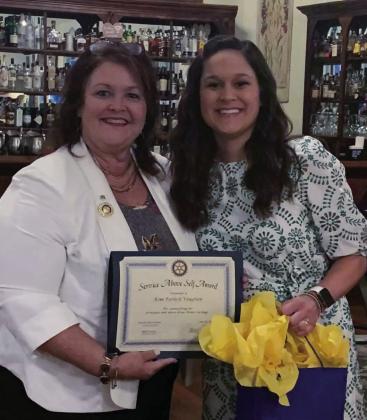 Kim Turlich Vaughan received the Service Above Self Award. Pictured with Vaughan is Mary Cheramie.