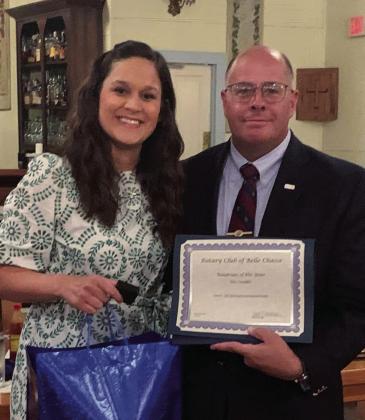 Mary Cheramie presented Eric Lundin with the Rotarian of the Year Award.