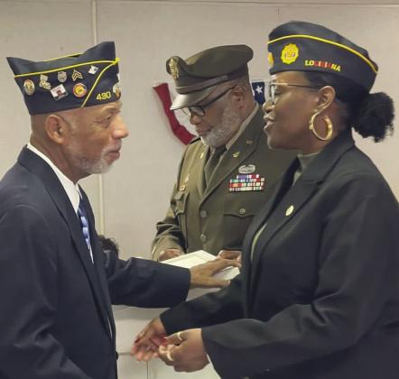 Outgoing commander Joseph Williams congratulates First Vice Commander Dr. Toshiba Narcisse on her new role.