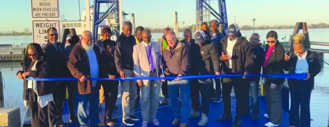 Parish residents, council members, and parish president Keith Hinkley celebrate the reopening of the Pointe a La Hache ferry with a ribbon cutting ceremony.