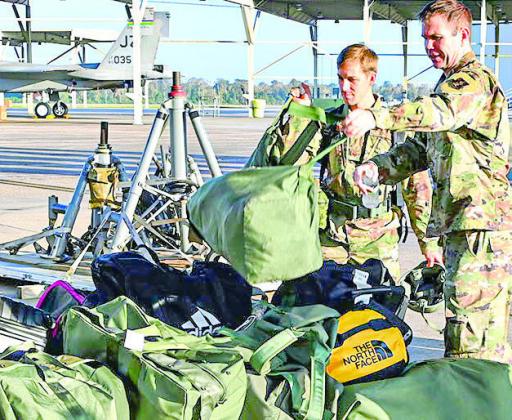 Airmen palletize personnel bags as part of a predeployment readiness exercise. US Air National Guard photo by Master Sgt. Toby Valadie)