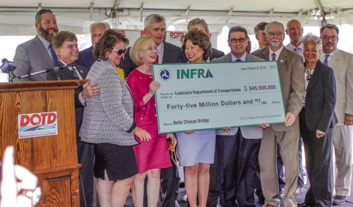O cials gather on August 8, 2018, to celebrate a $45 million dollar INFRA grant for the Belle Chasse Bridge Project.