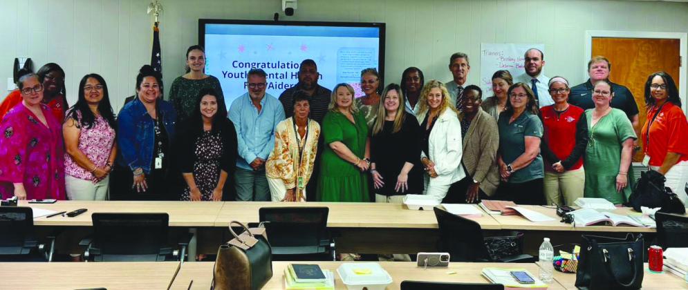 Teachers and other Belle Chasse High School sta participate in a mental health training session organized by the Magnolia Blossoms of Plaquemines.