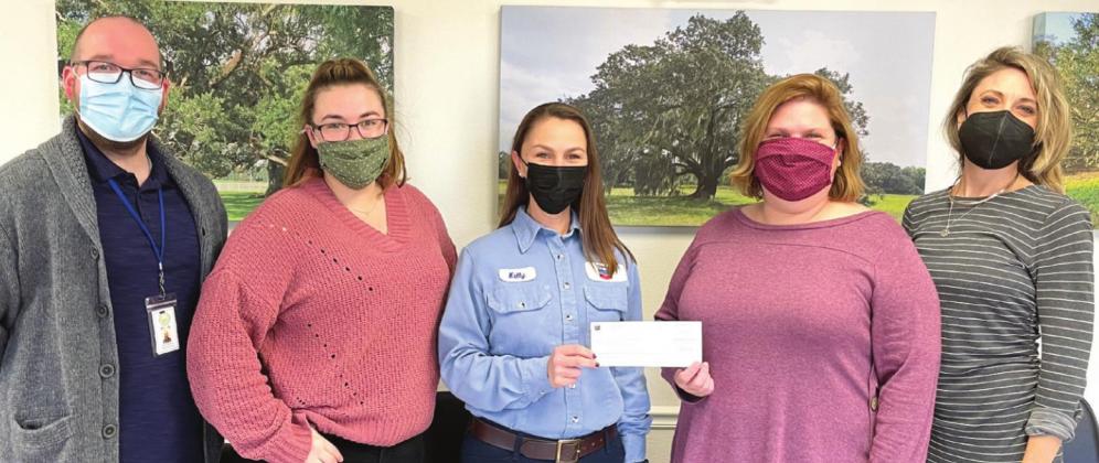 CARE Center staff members receiving the donation from WEN Lead, Kelly Colomb-Jennings.