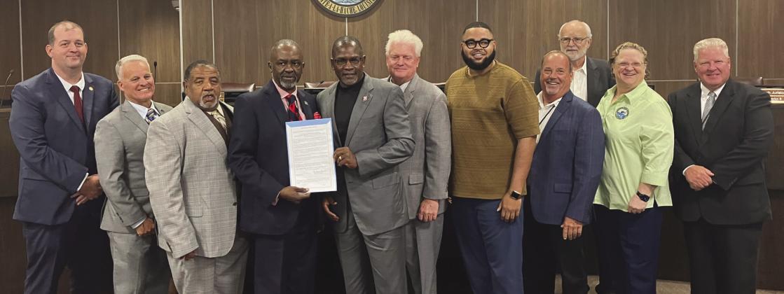 Reverend Dr. Michael Wade Jiles Sr. accepts his proclamation from council members. Council - Page 2