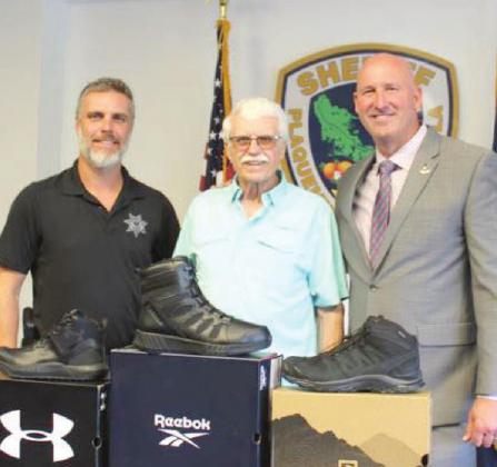 Pictured, from left: Lt. David McLean, Pastor George McLean and Sheriff Jerry Turlich.