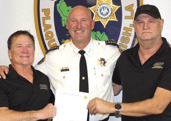 Pictured, from left: Frank Rulh, Sheriff Jerry Turlich and Randy Lincoln.