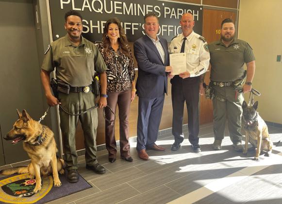 Pictured, from left: K9 Lobo, Sgt. Joseph Francis, Dana Palazzo, Leo Palazzo, Sheriff Jerry Turlich, Detective Bryan Munch and K9 Vader.