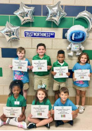 (Left to Right) First Grade: Levi Silkwood, Thomas Keegan, Kyrie Sylve, Mackenzie West, Brianna Philson, Audrey Vodopija, and Gionni Isemann.