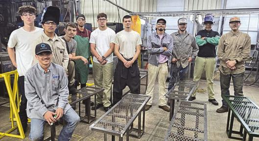 Nunez Welding Summer Internship students show o bike racks and benches they fabricated for St. Bernard Parish parks and trails. Each summer the Welding Summer Internship completes a public service project.