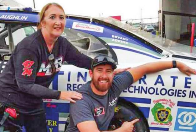 Pictured is Plaquemines Parish resident Debbie Mertz and CJ McLaughlin, driver of the #74 car for Mike Harmon Racing. Mertz is a pit crew member for McLaughlin.