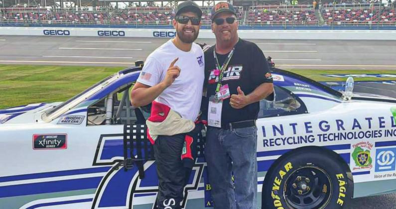 Pictured is Plaquemines Parish Fire Dept. Captain Kevin Coleman (right) with the #74 car's driver, CJ McLaughlin, just before the national anthem at the NASCAR Xfinity Series race on Oct. 2 at the Talladega Super Speedway.