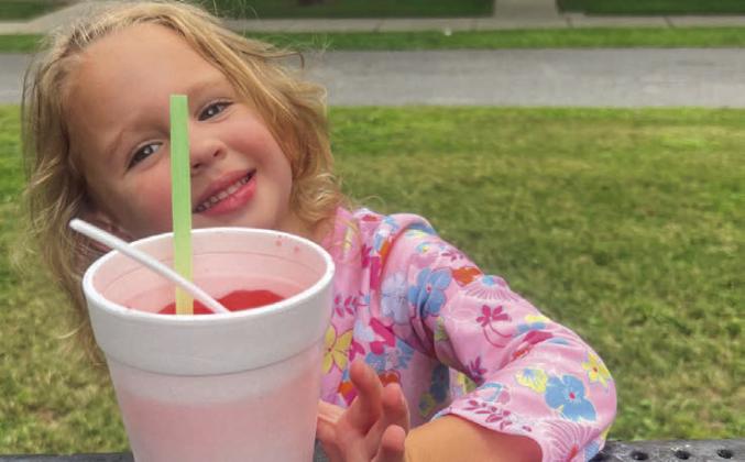 The adorable Phoebe Jones, daughter of Cody and Diana (Torres) Jones, cooling off with her Dairy Dip snowball!