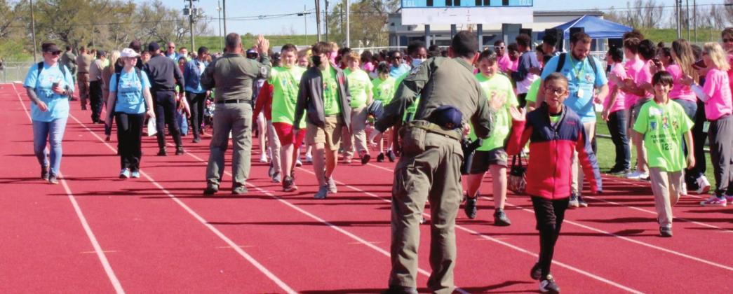 Members of the Plaquemiens Parish Sheriff’s Office greet the students.