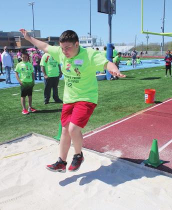 Student participating in the running long jump.