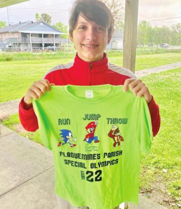 Belle Chasse Middle School student, Harvey Torres, with the shirt he designed for this year’s Special Olympics.