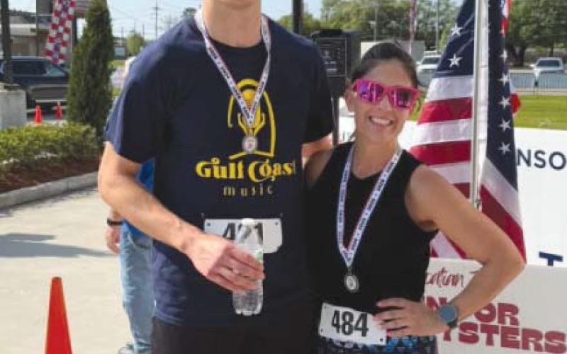 Winners of Run for the Oysters: Quincy Curley and Natalie Breaux.