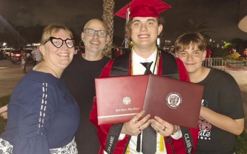 The Dardar family, co of Alicia, Timothy, Benjamin and Joseph, celebrate after Benjamin's graduation from Belle Chasse High and the University of Holy Cross.