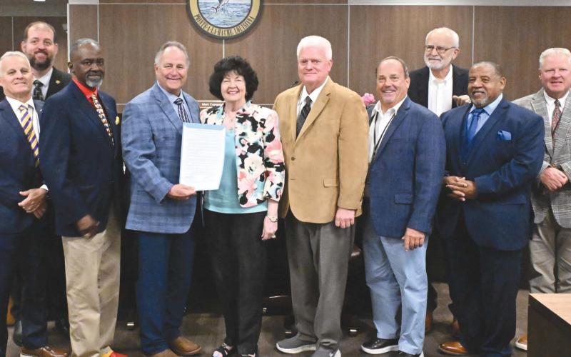 From left: District 2 council member Brian Champagne, district 3 council member Chris Schulz, district 1 council member Tyronne Edwards, Parish President Keith Hinkley, Peggy Martin, district 9 council member Mark 'Hobbo' Cognevich, district 8 council member Mitch Jurisich, district 4 council member Stuart Guey, district 7 council member Carlton LaFrance, and district 6 council member Ronnie Newsom.
