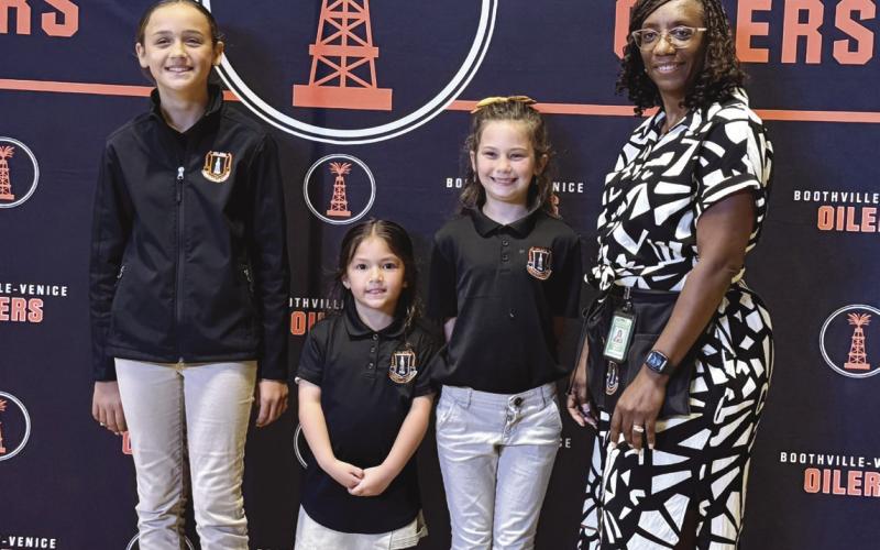 From left: Harper Guidry, Naveah Hua, Gracie Busby, and Principal Maria Prout.