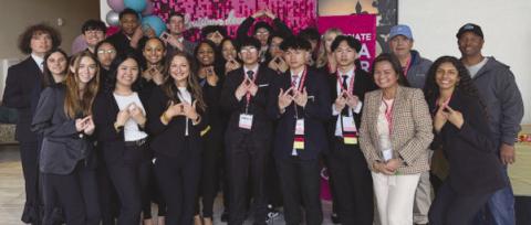 South Plaquemines High School DECA Members pose alongside District 8 School Board Member Paul W Lemaire Jr and District 7 School Board Member Bobby Ingraham during the Career Development Conference in Baton Rouge.