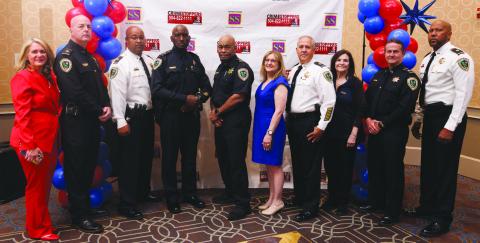 From left: Darlene Cusanza (President of Crimestoppers of New Orleans), Major Michael Martin, Captain Javon Ancar, Sgt. Craig Hudson, Sgt. Melvin Hudson, Lisa Romano (Oscar Tolmas Charitable Trust), Captain Eric Becnel, Rachele Popich, Sgt. Jack Owens, Major Byron Williams.