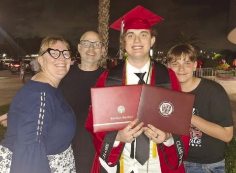 The Dardar family, co of Alicia, Timothy, Benjamin and Joseph, celebrate after Benjamin's graduation from Belle Chasse High and the University of Holy Cross.