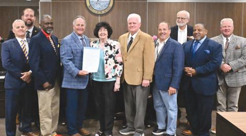 From left: District 2 council member Brian Champagne, district 3 council member Chris Schulz, district 1 council member Tyronne Edwards, Parish President Keith Hinkley, Peggy Martin, district 9 council member Mark 'Hobbo' Cognevich, district 8 council member Mitch Jurisich, district 4 council member Stuart Guey, district 7 council member Carlton LaFrance, and district 6 council member Ronnie Newsom.