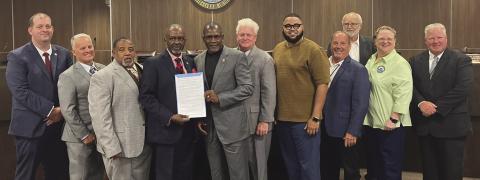 Reverend Dr. Michael Wade Jiles Sr. accepts his proclamation from council members. Council - Page 2
