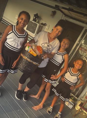 DTR Cheerleaders Provide Holiday Baskets to Parish Residents in Need