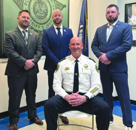 From left (standing): Lt. Jason Kornovich, Lt. John McDaniel, Captain Paul Durnin. (Seated): Sheri Jerry Turlich.