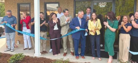 Local government o cials, school board o cials, representatives from parish businesses, and Nunez o cials celebrate the new facility with a ribbon cutting.