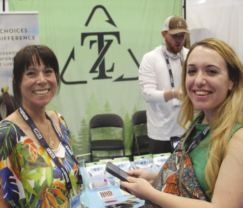 Visting the Zero Trace booth, pictured: Andrea (left), Evan (back) and Gabriella (right).