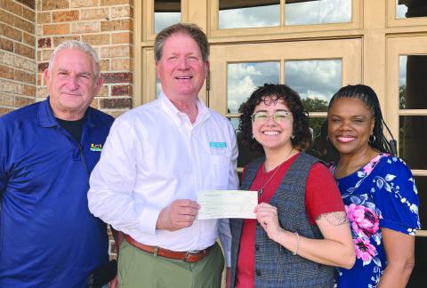 4-H sta Wayne Burgess, Lou Duplantier, and Marlena Cowart receive a donation from George Pivach II of the Venice Port Complex.