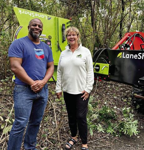 Robbie Robinson, Chevron Oronite corporate affairs representative, gets a first hand look at the Lane Shark funded by Chevron Oronite.