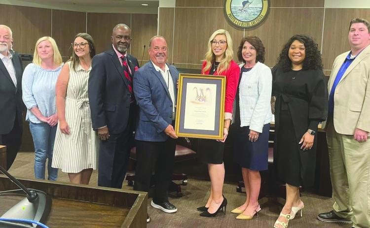 During the July 10 Plaquemines Parish council meeting, LED representative Pat Witty presented a certificate of achievement to PPG Economic Development Director Kelly DiMarco and the Economic Development Steering Committee in honor of their hard work and dedication.
