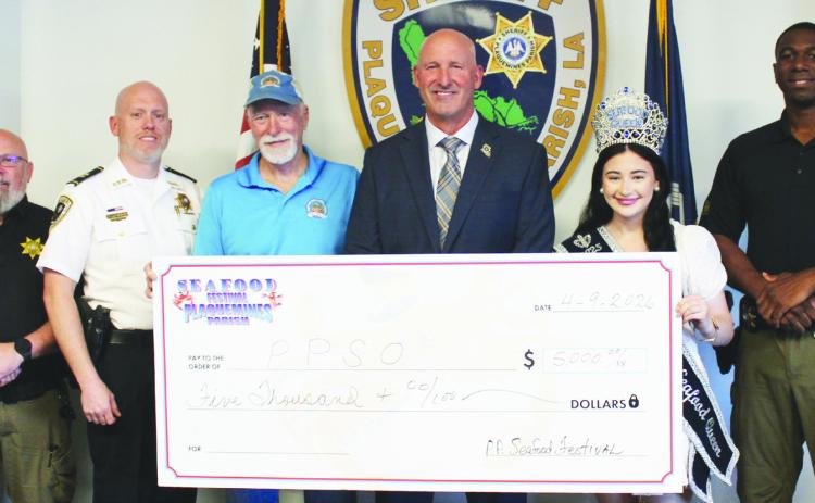From left: Sgt. Anthony Dugas, Captain Chris Johnson, Ernie Kientz, Sheri Jerry Turlich, Seafood Festival Queen Kadence Johnson, Detective Tre Sanders.
