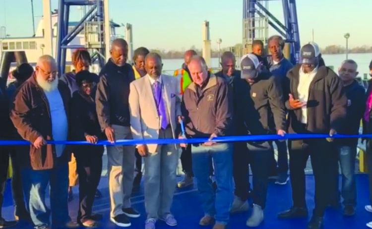 Parish residents, council members, and parish president Keith Hinkley celebrate the reopening of the Pointe a La Hache ferry with a ribbon cutting ceremony.