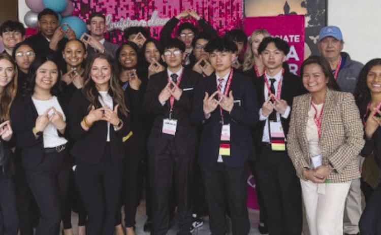 South Plaquemines High School DECA Members pose alongside District 8 School Board Member Paul W Lemaire Jr and District 7 School Board Member Bobby Ingraham during the Career Development Conference in Baton Rouge.