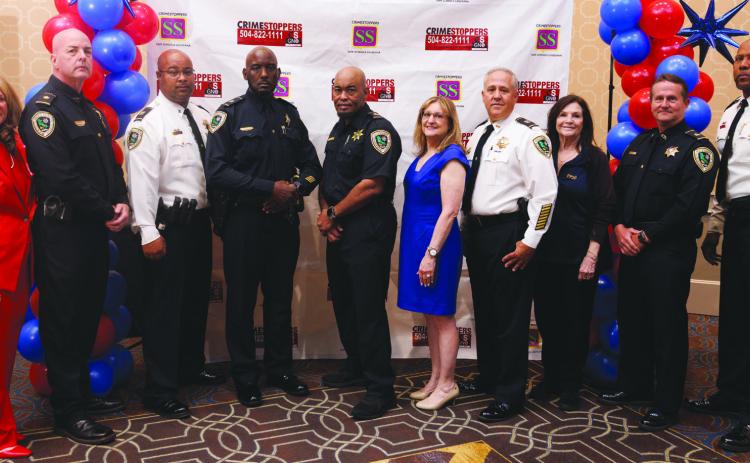 From left: Darlene Cusanza (President of Crimestoppers of New Orleans), Major Michael Martin, Captain Javon Ancar, Sgt. Craig Hudson, Sgt. Melvin Hudson, Lisa Romano (Oscar Tolmas Charitable Trust), Captain Eric Becnel, Rachele Popich, Sgt. Jack Owens, Major Byron Williams.