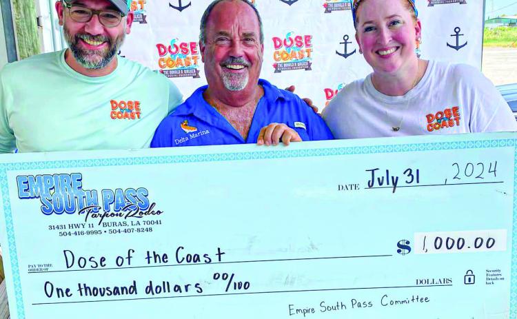 Dose of the Coast hosted its sixth annual event in Delta Marina to 'kick off' Empire South Pass Tarpon Rodeo. Pictured is Mitch Jurisich presenting the organization with a $1,000 donation.