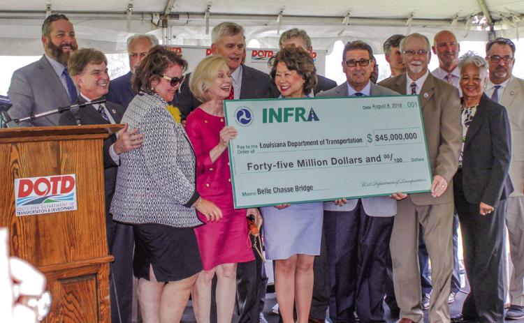 O cials gather on August 8, 2018, to celebrate a $45 million dollar INFRA grant for the Belle Chasse Bridge Project.
