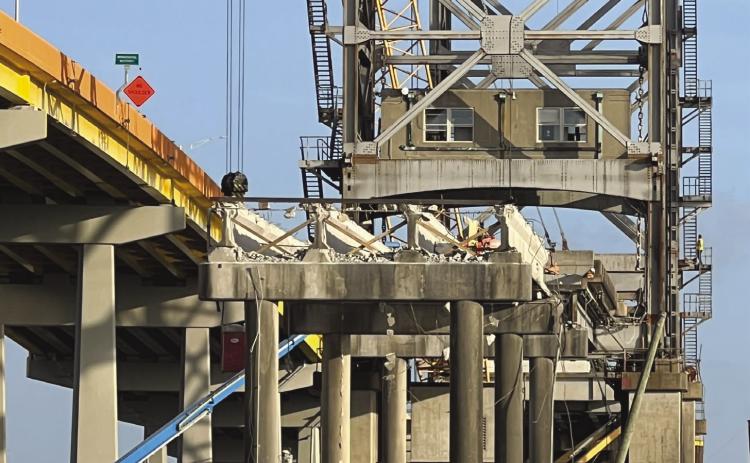 Bridges come down much faster than they go up. Over the past month, demolition of the Belle Chasse Bridge has seen the removal of the bridge deck, the counterweights, motors, and cables that operated the 60-year-old lift bridge. The concrete approach on the south side is nearly gone as well.
