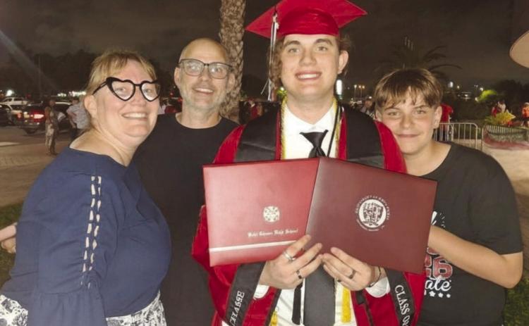 The Dardar family, co of Alicia, Timothy, Benjamin and Joseph, celebrate after Benjamin's graduation from Belle Chasse High and the University of Holy Cross.