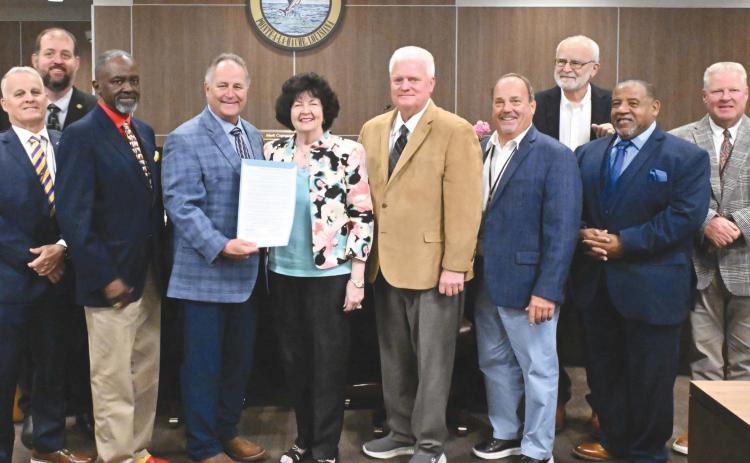 From left: District 2 council member Brian Champagne, district 3 council member Chris Schulz, district 1 council member Tyronne Edwards, Parish President Keith Hinkley, Peggy Martin, district 9 council member Mark 'Hobbo' Cognevich, district 8 council member Mitch Jurisich, district 4 council member Stuart Guey, district 7 council member Carlton LaFrance, and district 6 council member Ronnie Newsom.