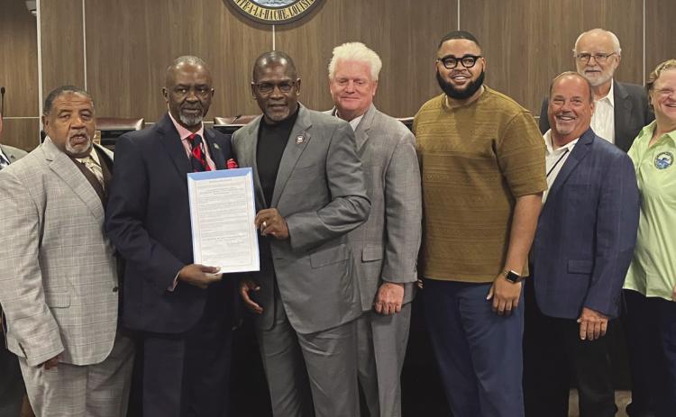 Reverend Dr. Michael Wade Jiles Sr. accepts his proclamation from council members. Council - Page 2